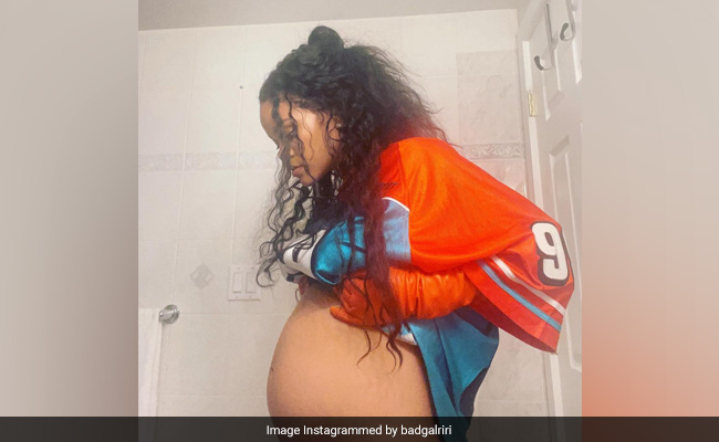 The Internet Was Distracted From Rihanna's Baby Bump By What's Behind Her