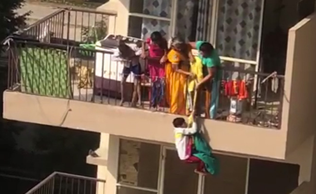 Video: Woman Dangles Son By Saree From 10th Floor To Get Clothes From 9th