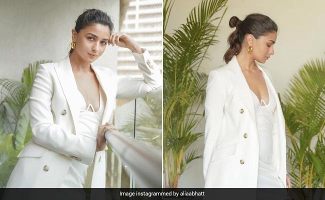 Alia Bhatt Wows Us In Her White Strap Dress Layered With A White Trench Coat