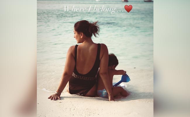 Just Kareena Kapoor On The Beach In A Black Swimsuit. Don't Miss Baby Jeh