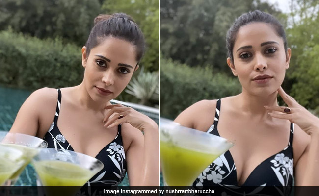 With Cocktails By The Pool, Nushrratt Bharuccha Is Summer Ready In Her Printed Black Swimsuit