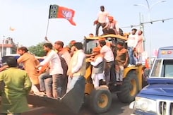 BJP Supporters, With A Bulldozer, Celebrate Party's Win In UP BJP Supporters, With A Bulldozer, Celebrate Party's Win In UP