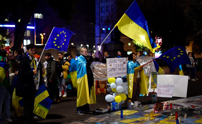 Side By Side, Ukrainian And Russian Flatmates March For Peace