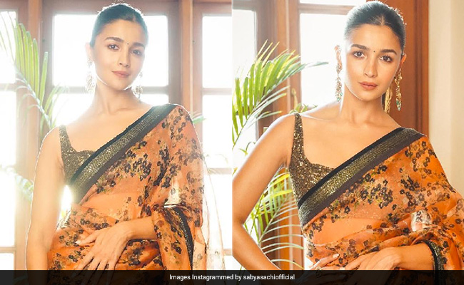 No Field Of Flowers Compares To Alia Bhatt In Her Stunning Orange And Black Floral <i>Saree</i>