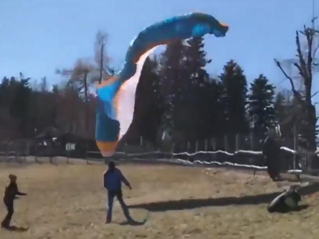 Dust Devil Throws Paraglider Against Fence