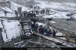 In Freezing Cold, Ukrainians Flee Capital Kyiv Over Bombed-Out Bridge In Freezing Cold, Ukrainians Flee Capital Kyiv Over Bombed-Out Bridge