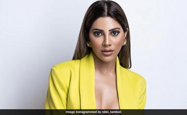 Nikki Tamboli Makes Heads Turn In Her Daring Neon Pantsuit