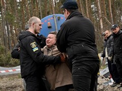 "My Little Son":Ukraine Woman Weeps By Grave On Route Of Russian Retreat