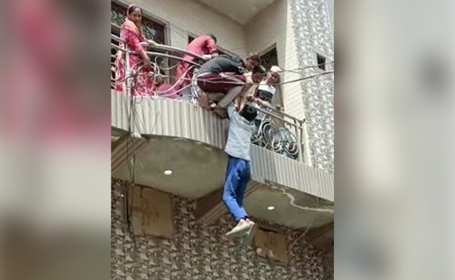 On Camera, Man Hanging From Balcony Pulled Up By Family In UP's Ghaziabad