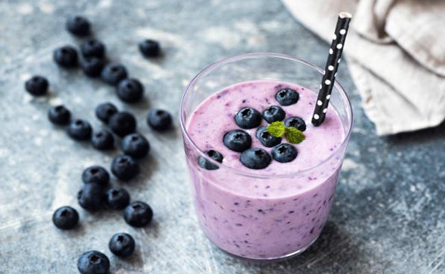 Prepare an antioxidant-rich protein shake by combining a banana and variety of berries