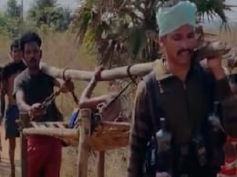 With Gun In One Hand, Jawan Shoulders A Cot Carrying Pregnant Woman With Gun In One Hand, Jawan Shoulders A Cot Carrying Pregnant Woman