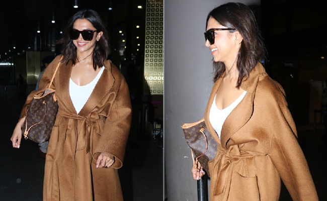 Deepika Padukone's Airport Look Is Complete With A Tan Trench Coat And Her Louis Vuitton Bag