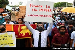Lankan Students March In Rain To PM's House As Protests Spiral Lankan Students March In Rain To PM's House As Protests Spiral