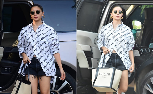 Alia Bhatt Chooses Designer Travel Casuals In A Rs 80K Balenciaga Shirt, Denim Shorts And A Rs 1.30 Lakh Celine Bag