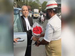 Telangana Chief Justice Seen Giving Traffic Cop A Bouquet. Read Why Telangana Chief Justice Seen Giving Traffic Cop A Bouquet. Read Why