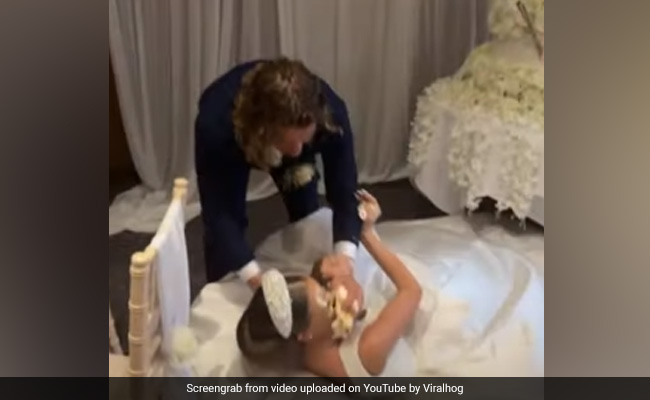 Viral Video Shows Groom Smashing Wedding Cake In Bride's Face, Internet Calls Him "Spoiler"