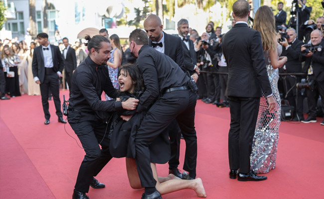 "Stop Raping Us": Topless Woman's Ukraine Protest On Cannes Red Carpet