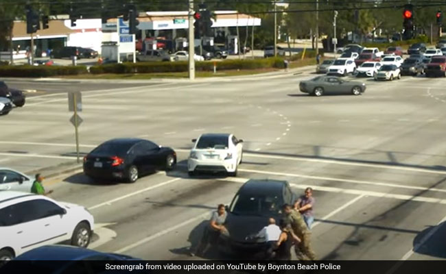 Watch: People Stop Car With Bare Hands For Woman Having Medical Episode