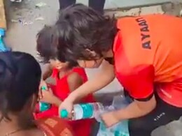 Young Boy Distributes Water Bottles To Help People Beat The Heat; Internet Approves
