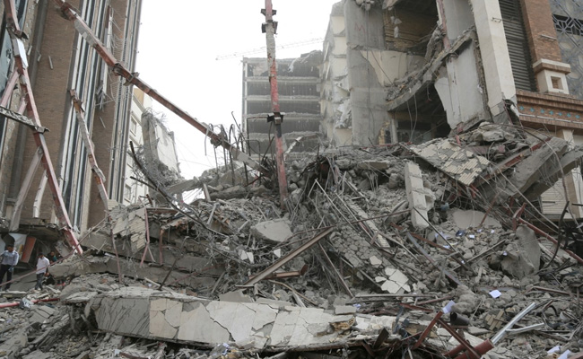 Iranian Police Fire Shots To Disperse Protesters Over Building Collapse