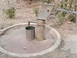 Man Bathes On Street With Drain Water, Sings To Protest Water Shortage In Guwahati Man Bathes On Street With Drain Water, Sings To Protest Water Shortage In Guwahati