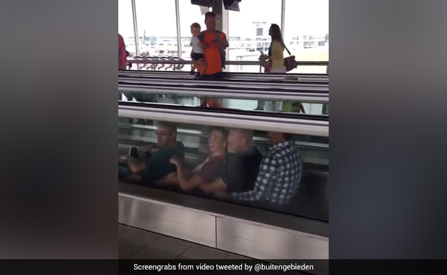 Viral Video Shows Men Rowing Boat On Moving Walkway At Airport