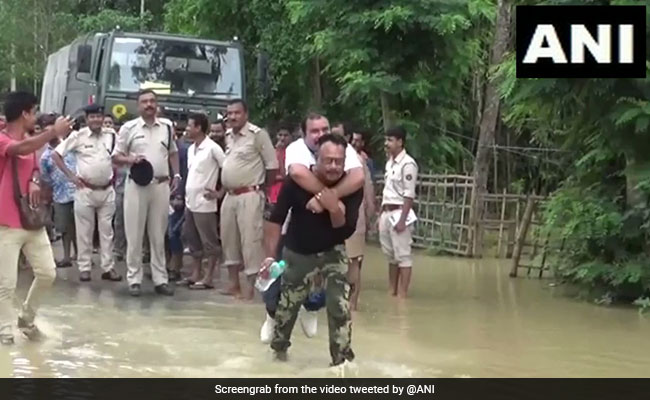 Watch: Assam BJP MLA Slammed For Piggyback Ride During Flood Review