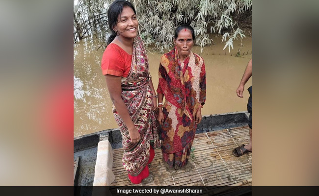 IAS Officer Walks Barefoot Through Mud In Flood-Hit Assam, Pic Is Viral