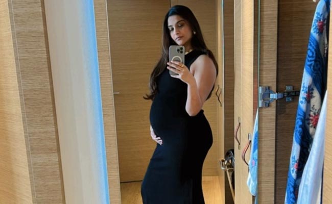 Sonam Kapoor Shows Off Baby Bump In Black Bodycon Dress