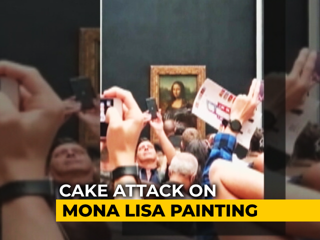 Man Disguised As Elderly Woman Smears Mona Lisa Portrait With Cake