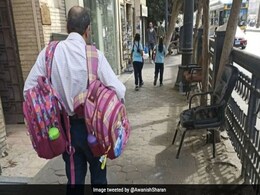 बच्चों के स्कूल बैग टांगकर ले जा रहे शख्स की तस्वीर हुई वायरल, IAS बोला- कुछ कर्ज़ कभी चुकाए नहीं जाते बच्चों के स्कूल बैग टांगकर ले जा रहे शख्स की तस्वीर हुई वायरल, IAS बोला- कुछ कर्ज़ कभी चुकाए नहीं जाते