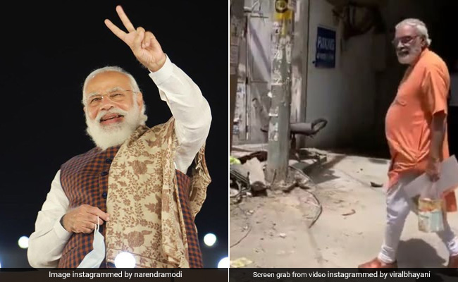हाथ में घर का सामान और रोड पर घूमते प्रधानमंत्री के हमशक्ल को देख हैरान हुए लोग, जमकर वायरल हो रहा है वीडियो