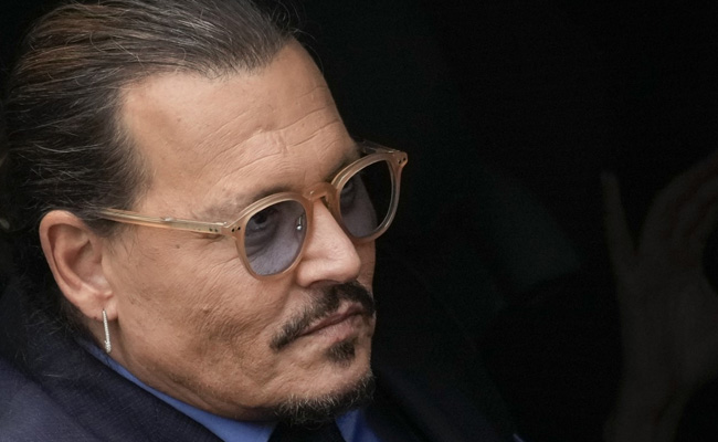 Photos Of Johnny Depp Helped Out Of Hotel Go Viral. Here's The Truth