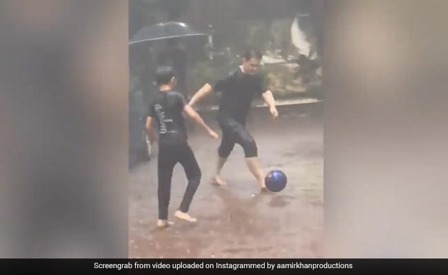 Nothing To See Here. Just Aamir Khan And Son Azad Playing Football In The Rain