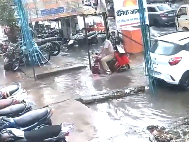 Cop, Wife Fall Into Drain On Waterlogged Road