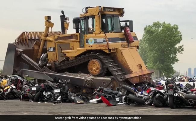 On Camera, Bulldozer Crushes Nearly 100 "Destructive" And "Dangerous" Bikes In New York
