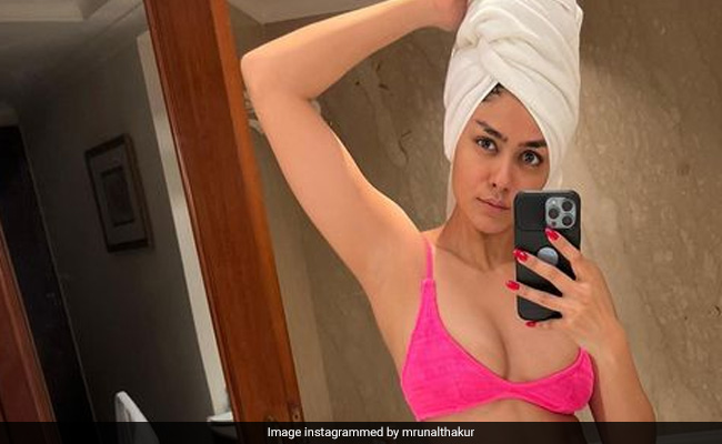 Mrunal Thakur In A Bright Pink Swimsuit "Curbs Midnight Cravings" In The Most Stylish Way