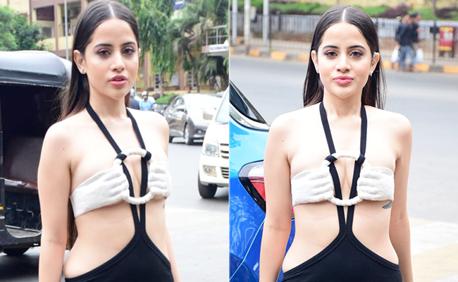 We've Got Our Hands Held High In Approval For Urfi Javed In A Black And White Cutout Dress