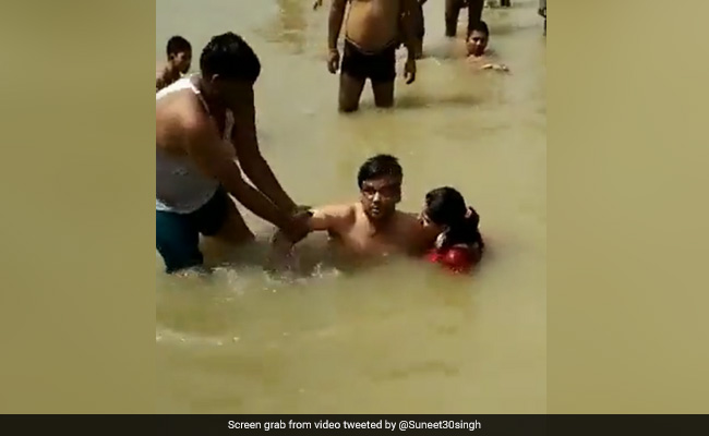 On Camera, Man Beaten For Kissing Wife While Bathing In Ayodhya River