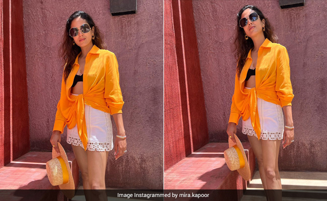 Mira Rajput Makes Summer In Sicily Look Fabulous In An Orange Shirt, Black Bralette And White Lace Skirt