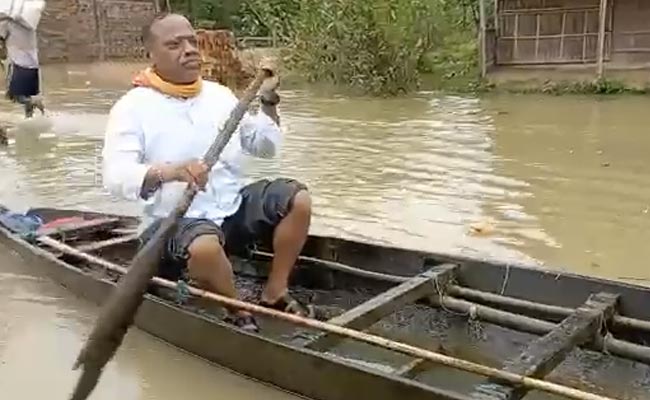 Watch: Assam Minister Turns Boatman To Ferry Man To Hospital Amid Floods