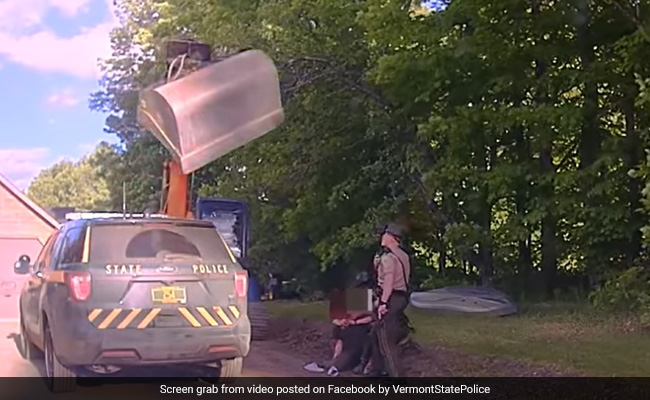 On Camera, Father Attacks Police Officers With Excavator To Stop Son's Arrest