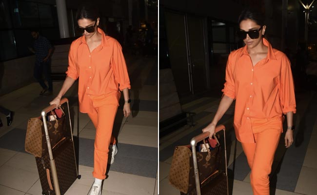 Deepika Padukone's Orange Co-Ord Set With A Louis Vuitton Bag Is Making Grey Travel Days Look Zesty