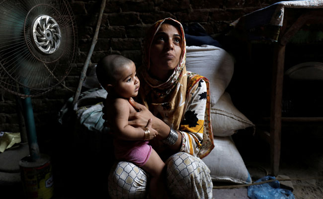 Mothers Bear Brunt Of Climate Change In World's Hottest City In Pakistan