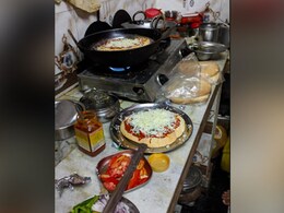 This Homemade Pizza And Makeshift Oven Are Winning Hearts Over the Internet