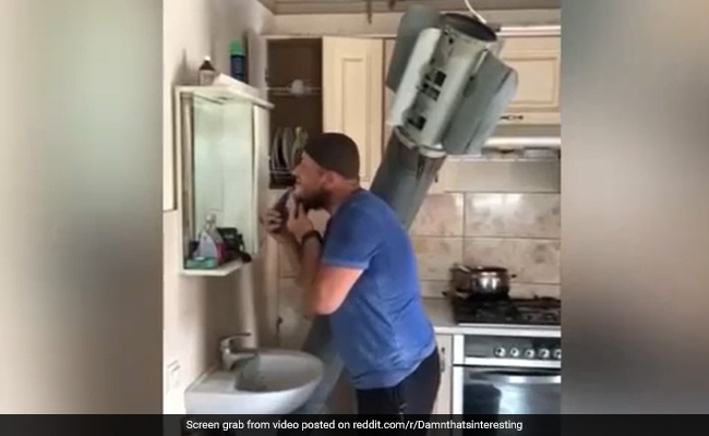 Video Shows Ukrainian Man Casually Shaving Beard While A Missile Is Lodged In His Home