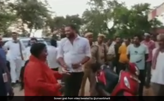 Watch: BJP's Uma Bharti Throws Cow Dung At Liquor Shop Over Prohibition Demand