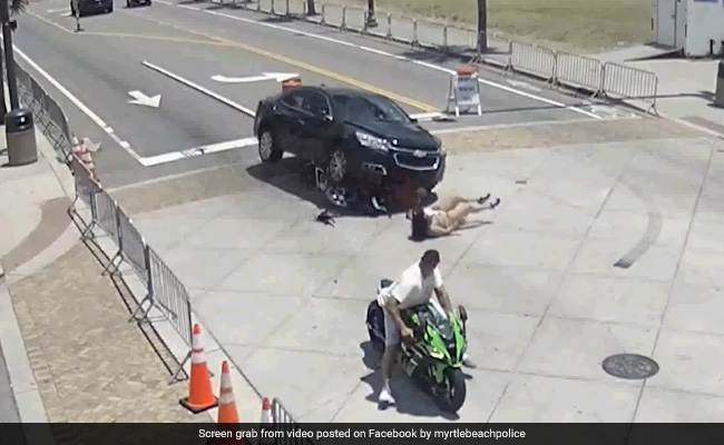 Dramatic Video Shows Bystanders Lifting Car To Rescue Motorcyclist After Crash