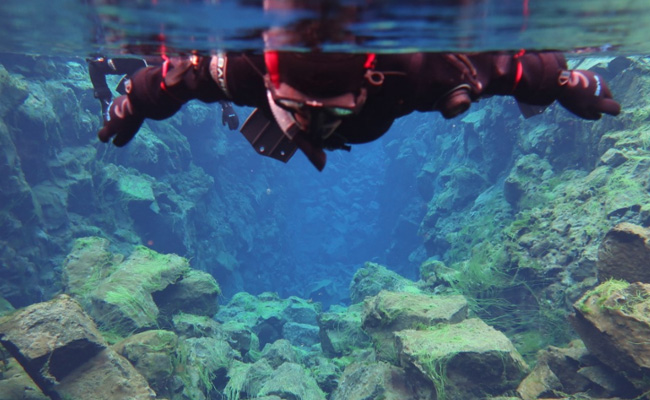 Divers Take "Incredible" Icy Dip Between 2 Continents In Iceland