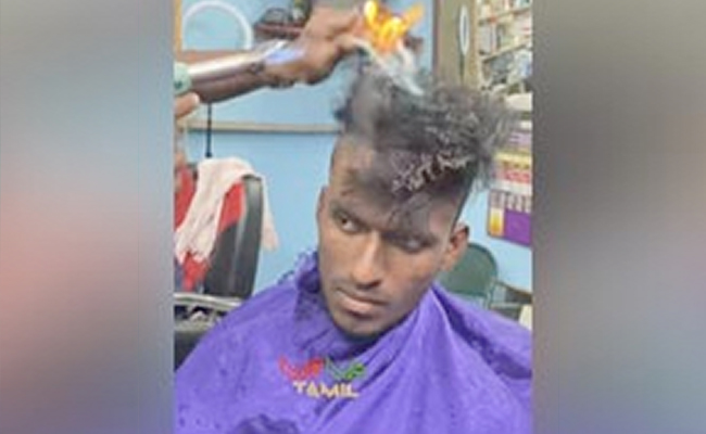 शख्स के सिर पर आग लगाकर बार्बर ने बनाया नया हेयर स्टाइल, VIDEO देखने वालों की अटक गई सांसें!